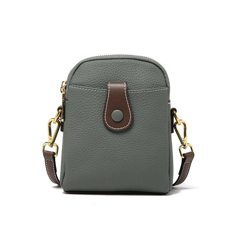 Sleek durable leather phone pouch with adjustable strap and multiple compartments.