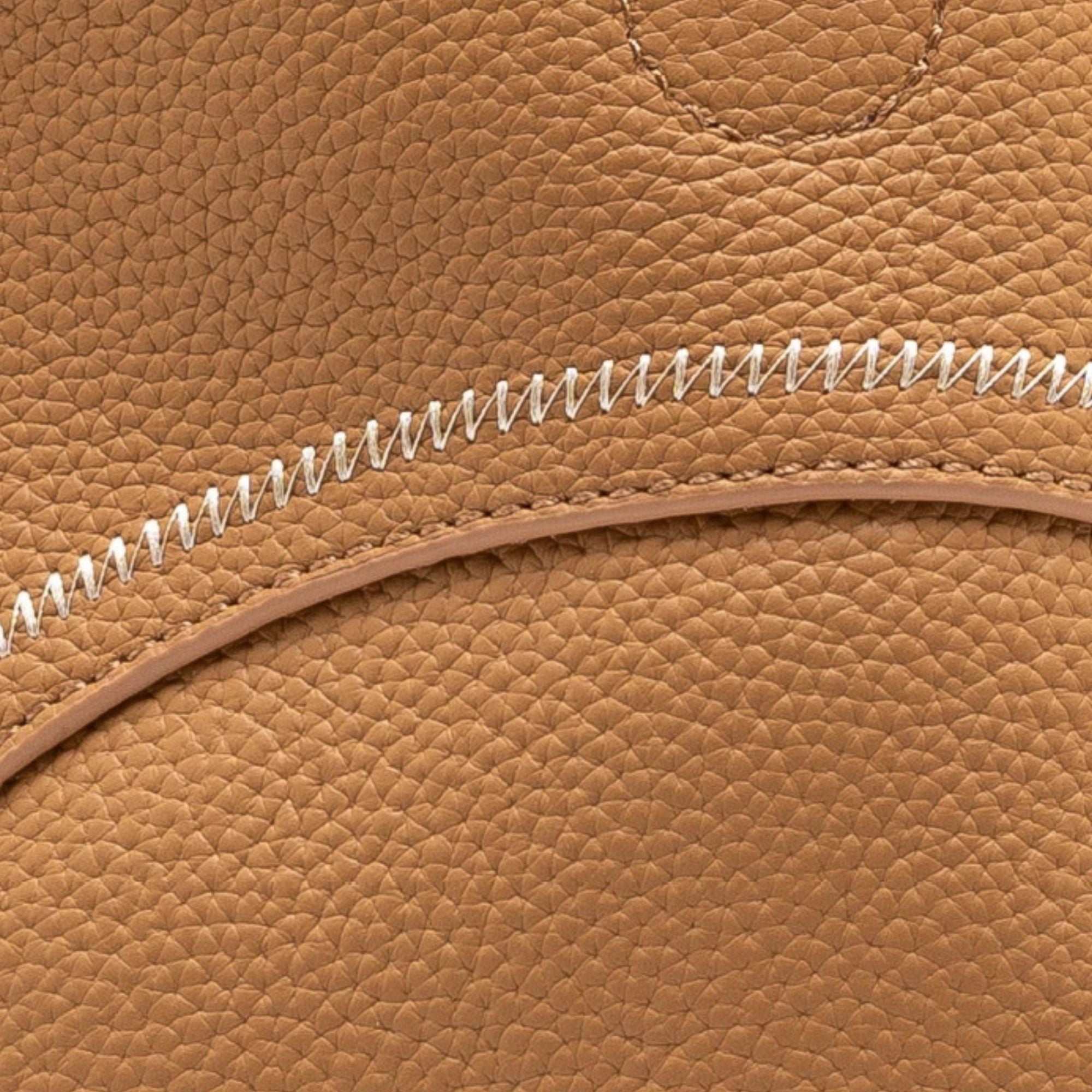 Mercer leather crossbody bucket tote with circular handles and removable pouch