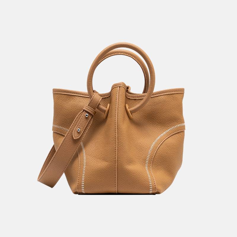 Mercer leather crossbody bucket tote with circular handles and removable pouch