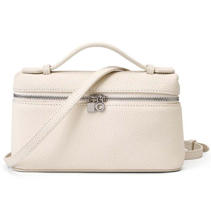 Mini handbag crossbody in lychee-textured leather with zipper, versatile carry options, and compact design.