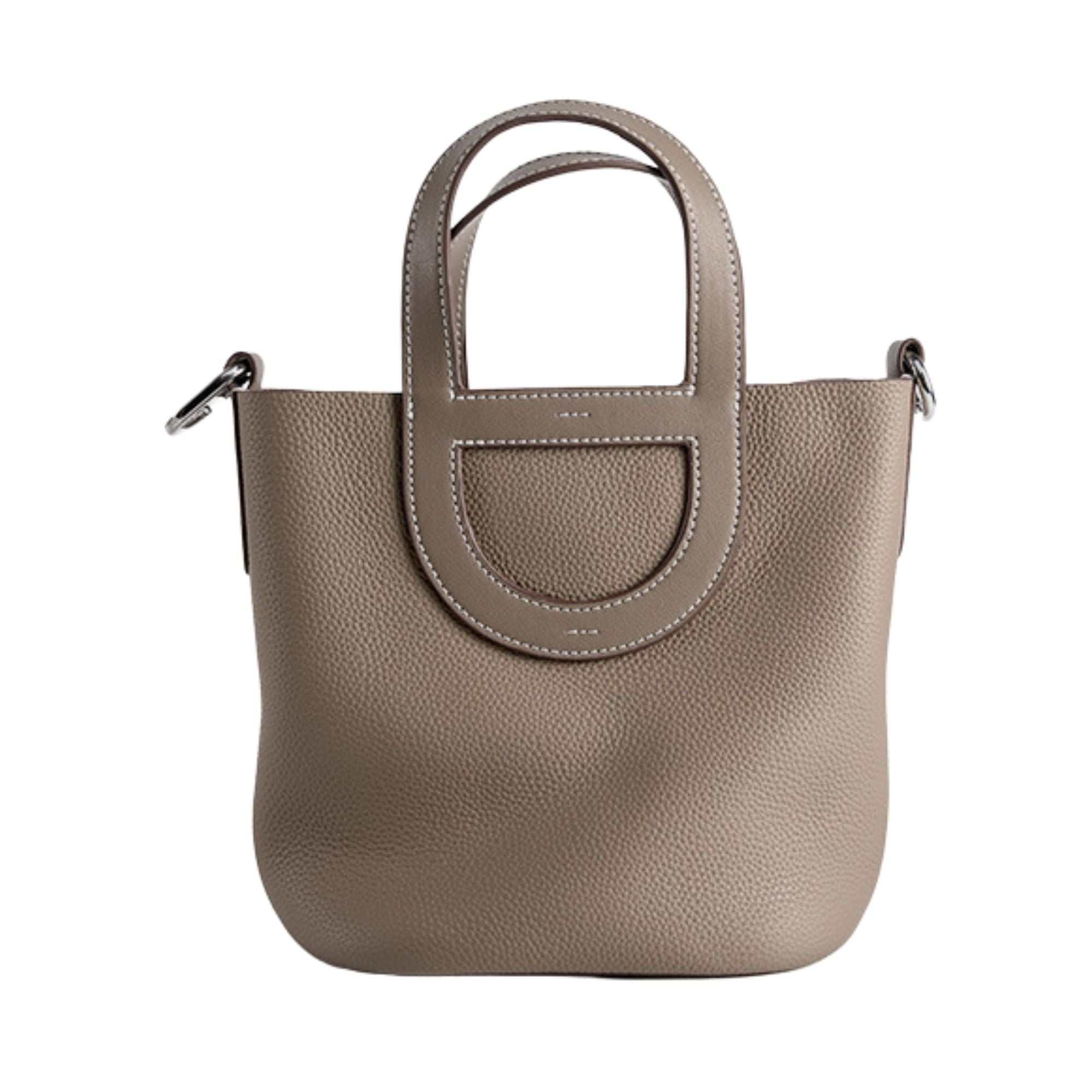 Sleek Leather Bucket Handbag with lychee-pattern design and removable strap.