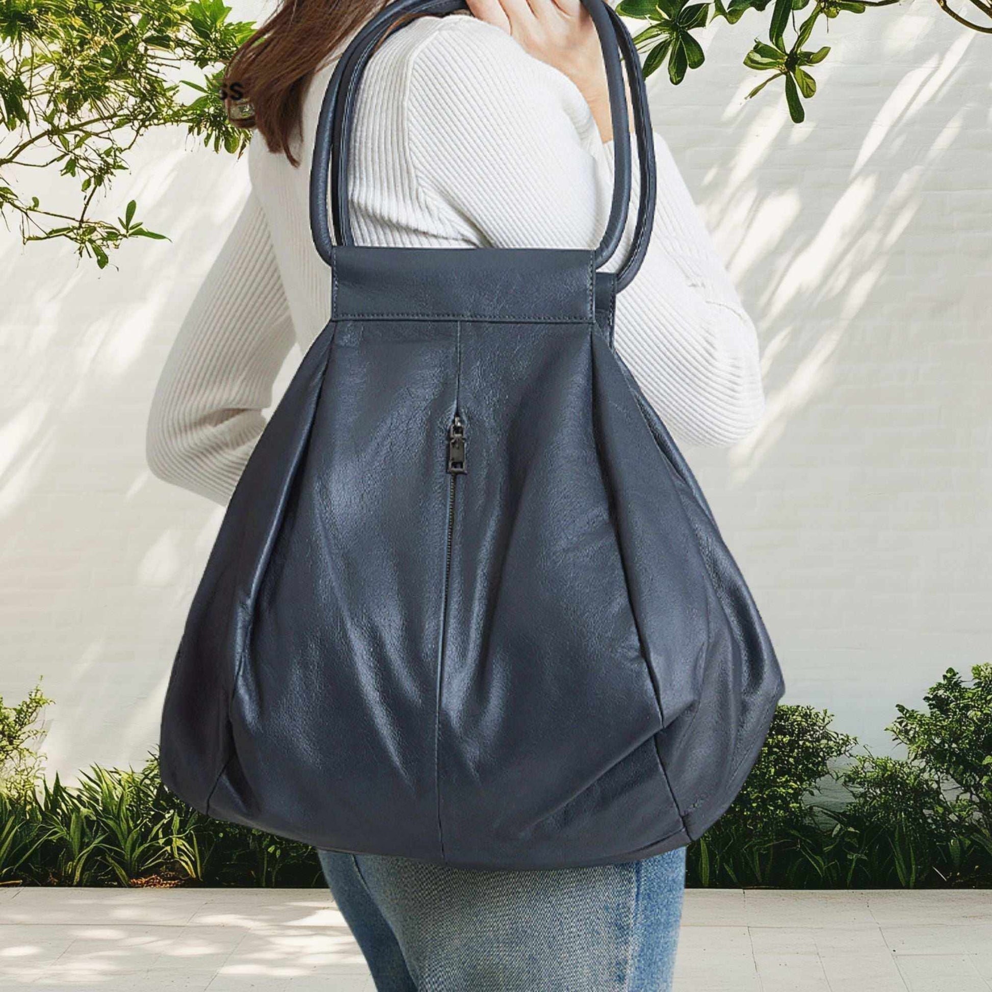 Slouchy leather bag in darkest blue, genuine leather, modern style, versatile tote.