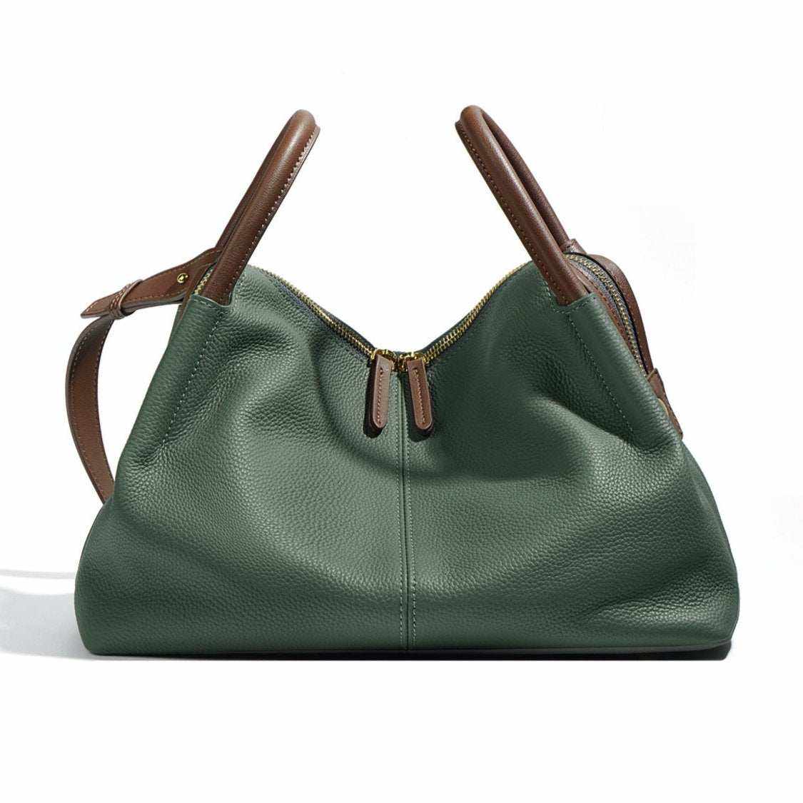 Soft leather crossbody bag with dual handles in green color on display.