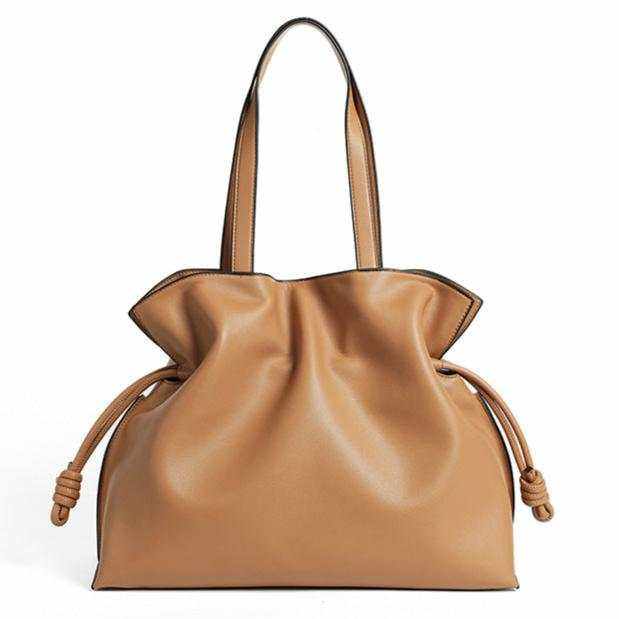 Soft leather tote bag with drawstring closure and pleated exterior from the Essence of Elegance Handbag Collection.