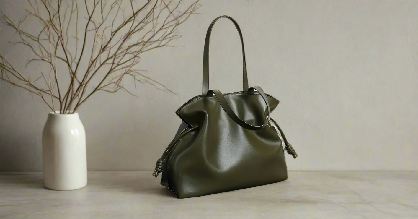 Soft Leather Tote bag on table with vase and branches in background