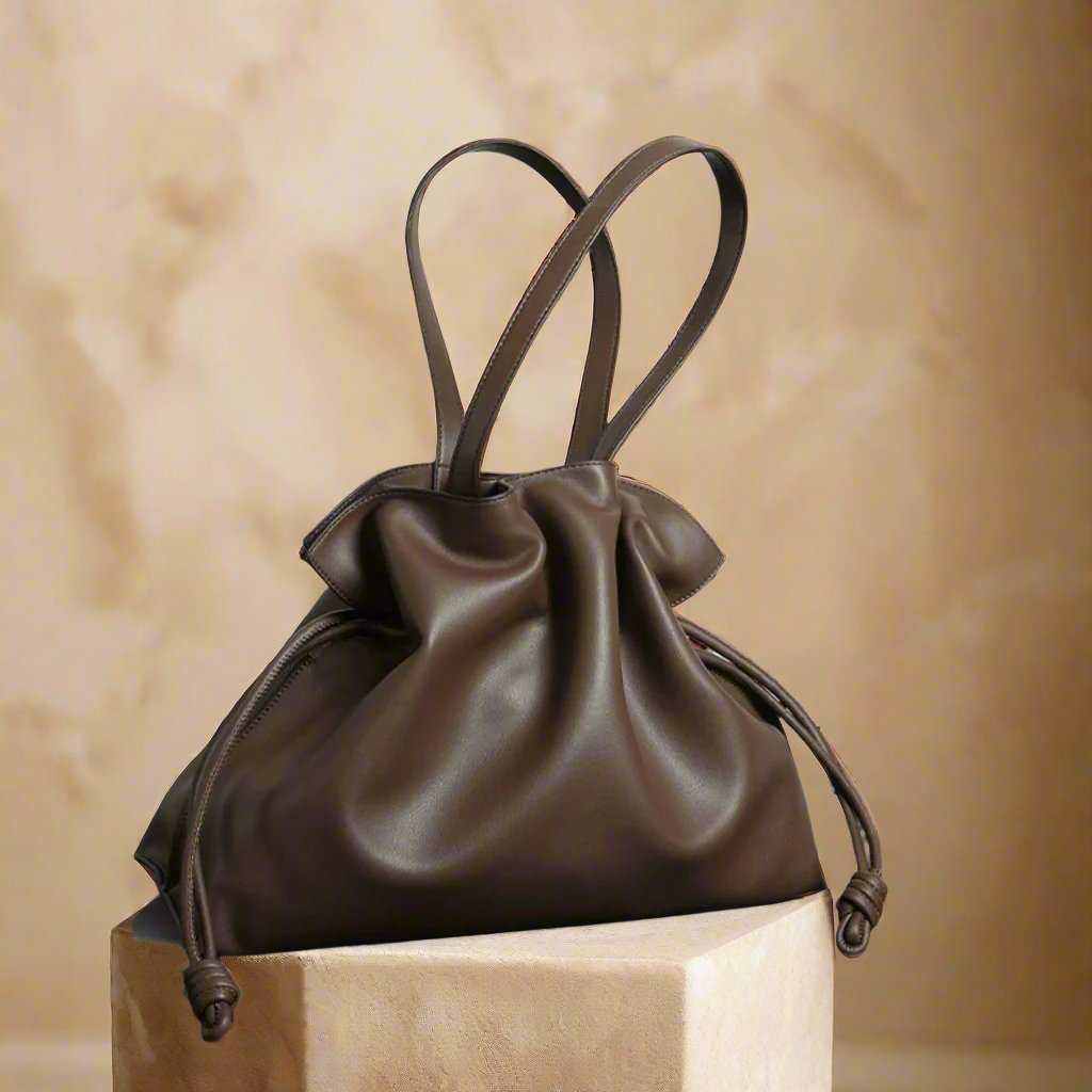 Soft Leather Tote with drawstring closure on display.