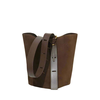 Brown suede bucket bag with adjustable strap and sleek design.