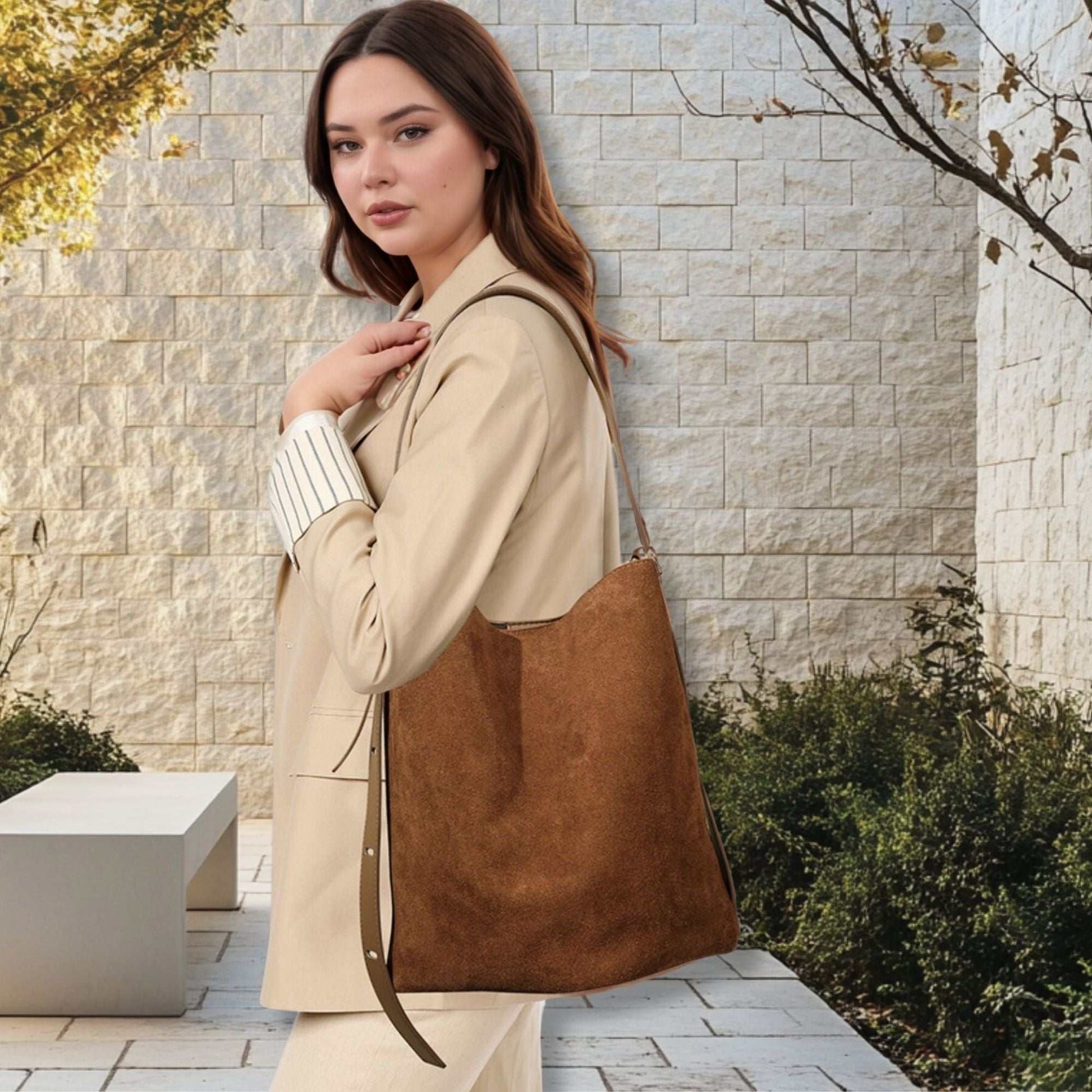 Suede Bucket Bag with convertible design worn by a model outdoors.