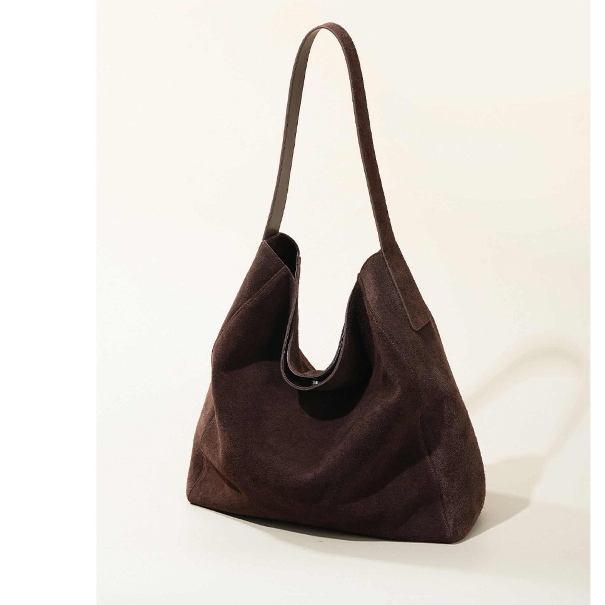 Suede Slouch Bag with single-shoulder design and reinforced bottom, part of Suede Pocketbook Collection.