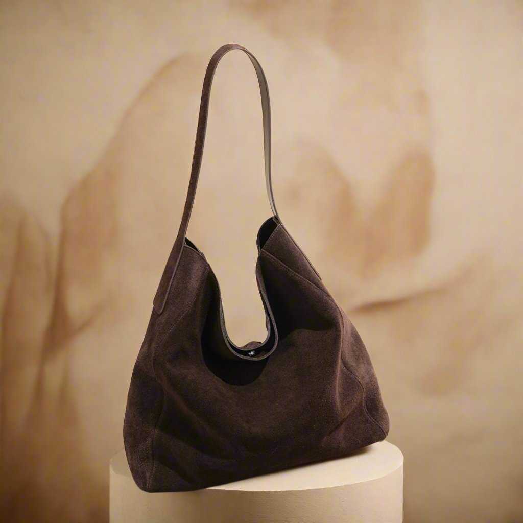 Suede Slouch Bag with single-shoulder design and spacious interior.