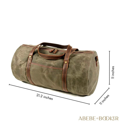 Waxed canvas duffle bag with genuine leather handles, 21.3"x11"x11", durable and stylish travel essential.