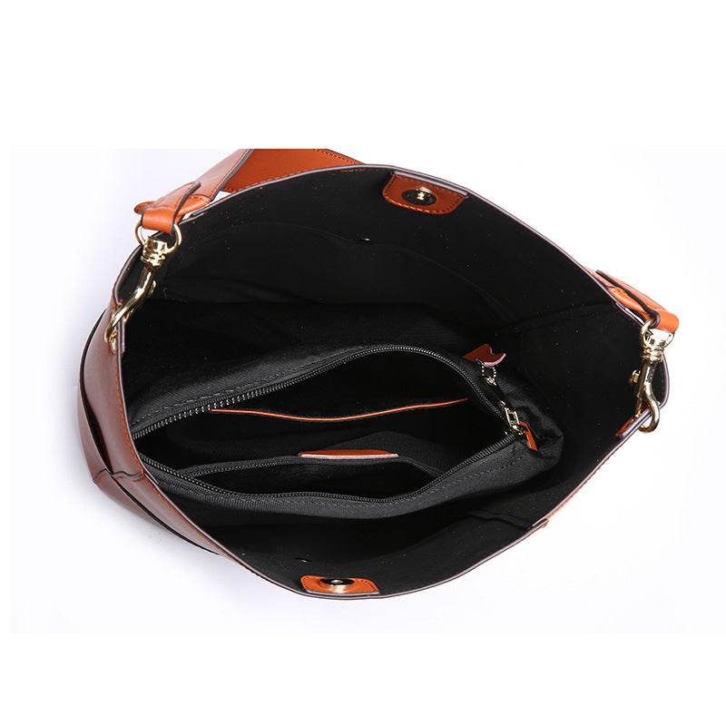 Elegant women's bucket bag with spacious interior and genuine leather craftsmanship.