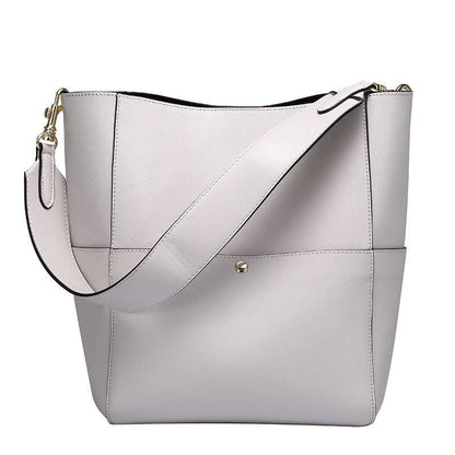 Elegant white women's bucket bag made from genuine leather, featuring removable shoulder strap and spacious interior.