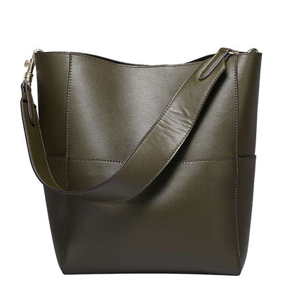 Genuine leather womens bucket bag with adjustable strap and spacious interior.