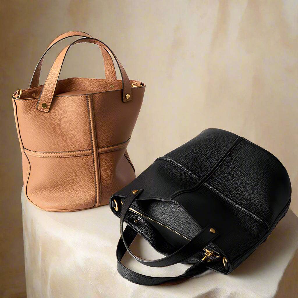 Elegant women's leather work bags in tan and black from the Leather Bucket Bags Collection.