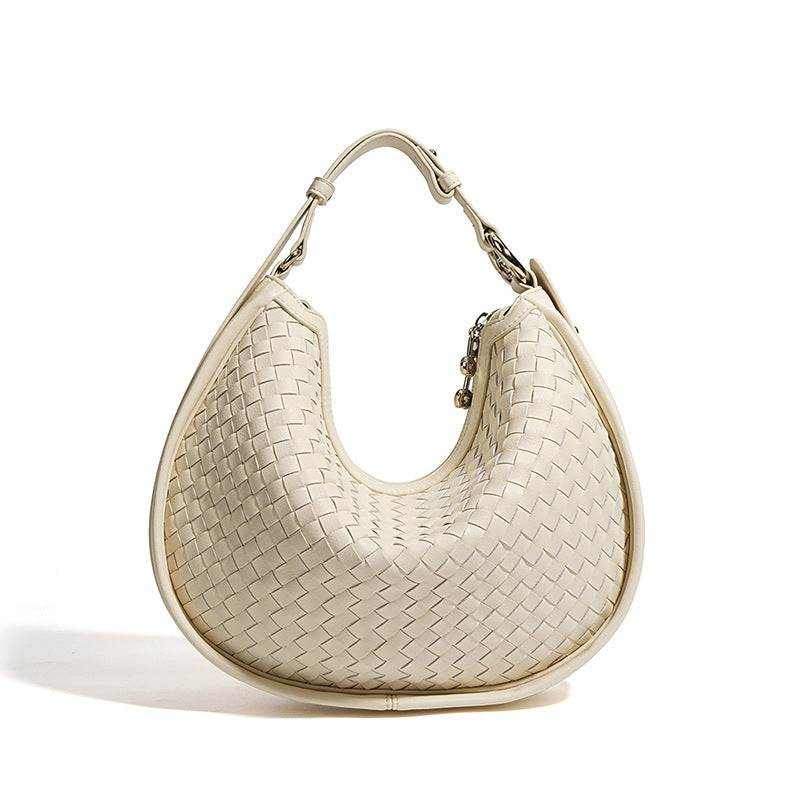 Elegant woven leather crossbody bag with adjustable strap, sophisticated design, and practical features.