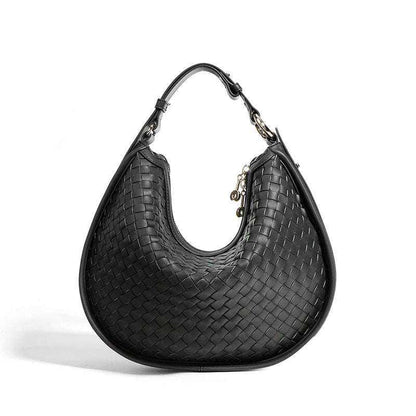 Woven leather crossbody bag with adjustable strap and sleek design.