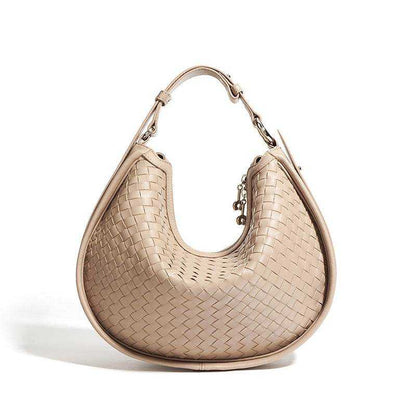 Woven leather crossbody bag in a stylish design with adjustable strap.