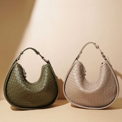 Woven leather crossbody bags in sage green and beige, showcasing adjustable straps and elegant craftsmanship.