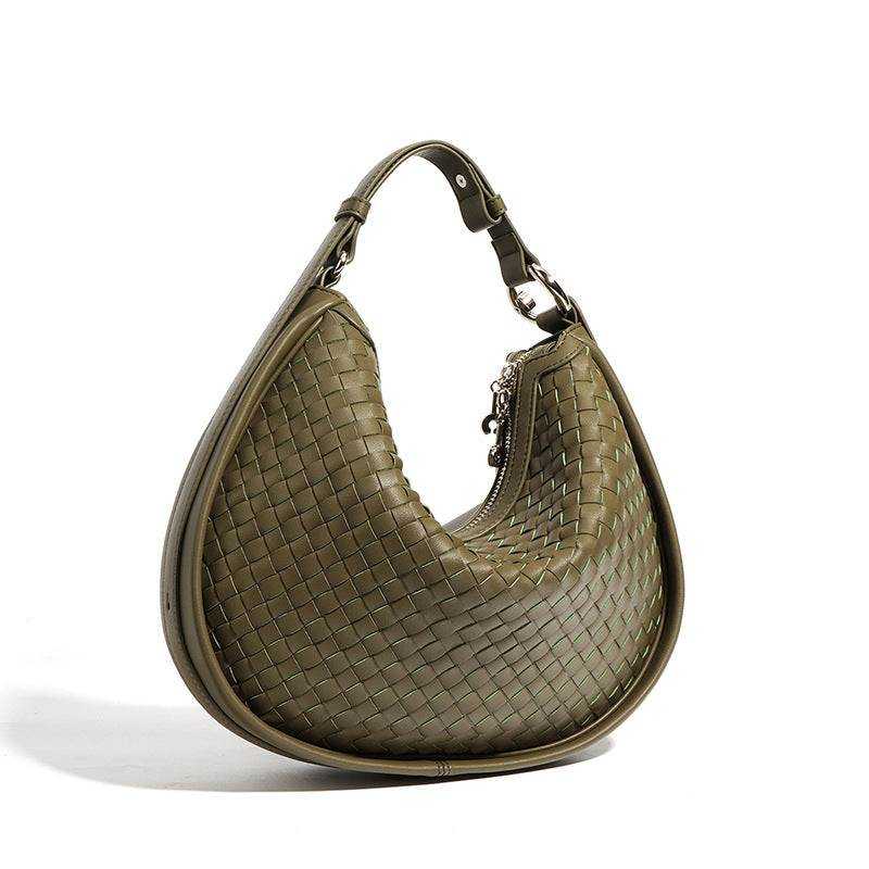 Woven leather crossbody bag in sage green with adjustable strap and durable design.