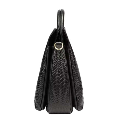 Side view of a black woven leather handbag with elegant pattern and gold accents.