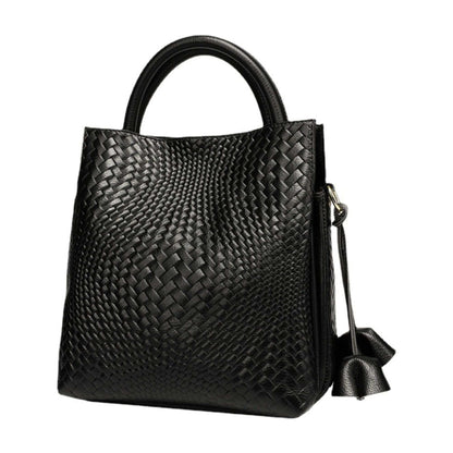 Woven leather handbag with elegant pattern, genuine leather, versatile design.