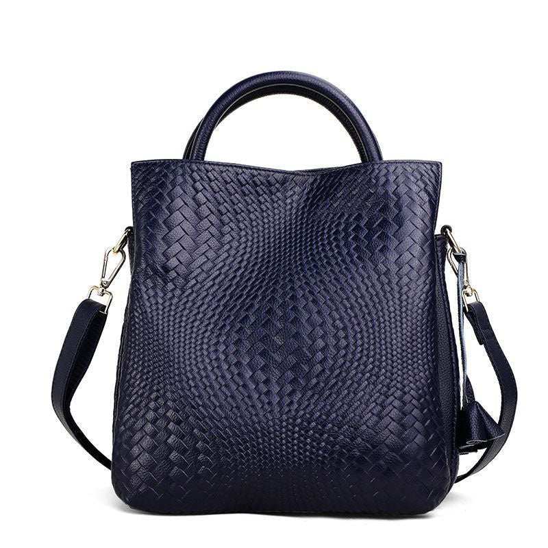 Woven Leather Handbag with elegant pattern and versatile design in genuine leather.