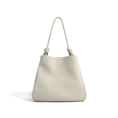 Woven Leather Tote Bag with basket weave design and leather rod handles.