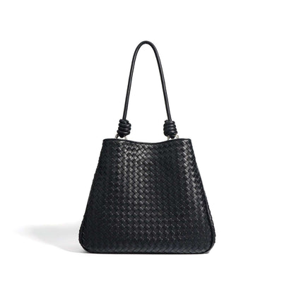 Woven Leather Tote Bag in black, featuring a basket weave design and leather rod handles, part of the Essence of Elegance Handbag Collection.