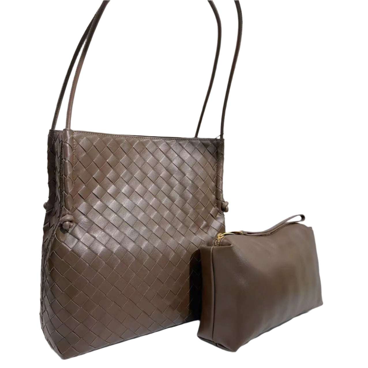 Woven leather tote handbag with removable interior bag and magnetic closure.