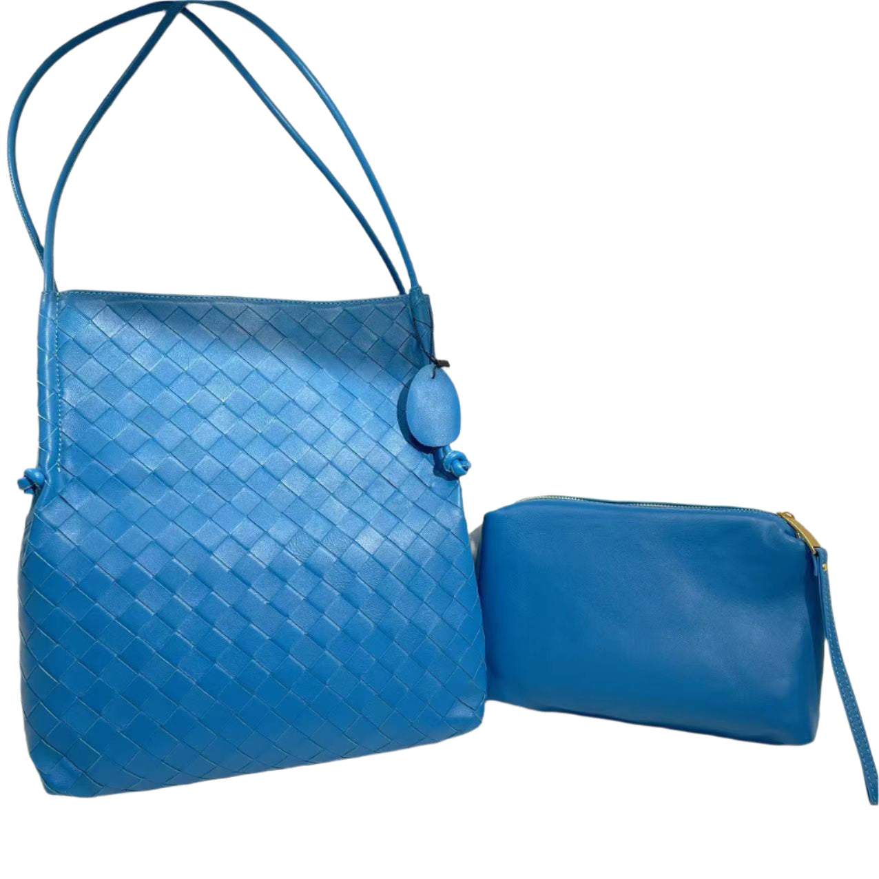 Woven Leather Tote Handbag in blue with removable interior bag and embossed pattern.