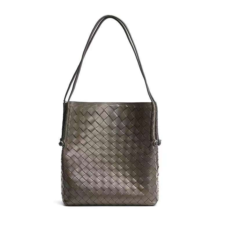 Woven Leather Tote Handbag in gray with a stylish embossed pattern.