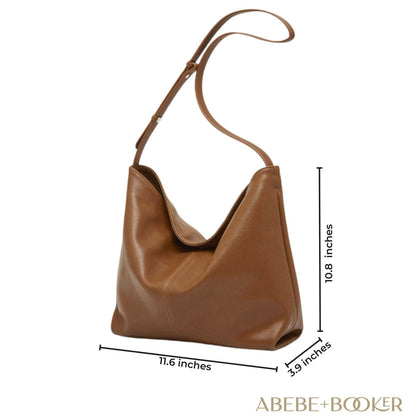 Slouchy Leather Purse with adjustable strap, brown color, spacious design, and elegant finish.